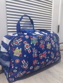 Wildkin Kids Overnighter Duffel Bag featuring a blue robots pattern.