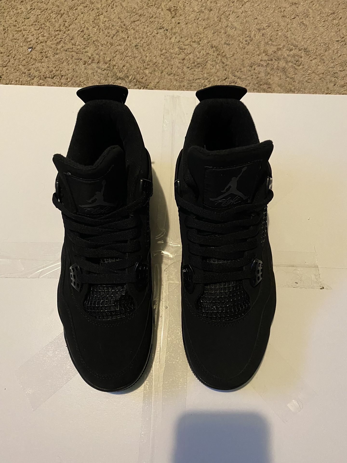 Black Cat Jordan 4’s