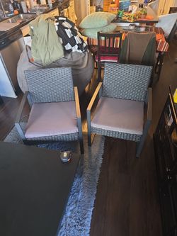 Outdoor wicker chairs (2) and small end table for patio
