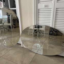 Modern frameless wall mirrors with beveled edge.