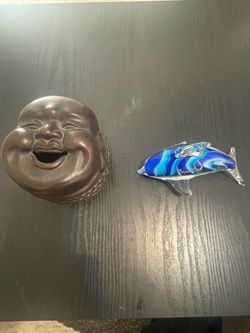 Buddha coin bank and cape cod dolphin