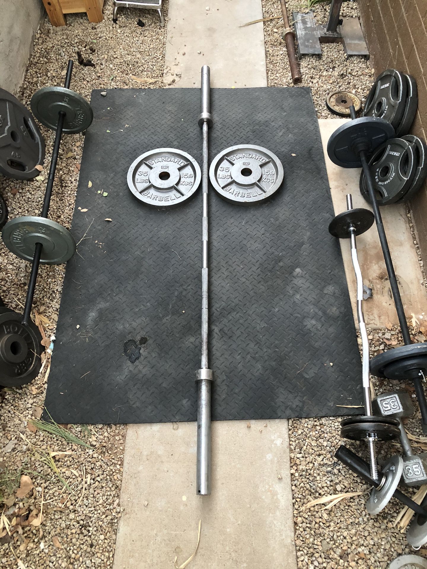 7 foot Olympic Bar / barbell and weight plates...$225 OBO