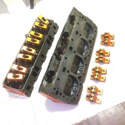 Chevy 350 heads. Harlan sharp roller tip rocket arms.