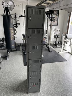 6-door vertical locker, (6’ H x 1’ W x 18” deep) all lockable. In Good Used Condition.