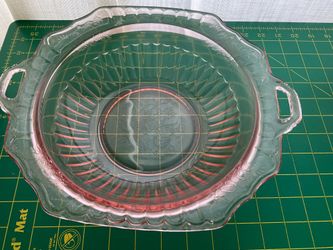 Pink depression glass 3 footed bowl 10 1/2”.