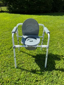 Brand New Adjustable Bedside Commode Chair