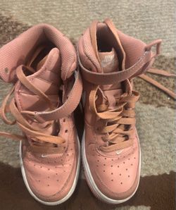 Nike Air Force 1 High in a dusty rose / pink leather colorway.