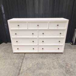 Clean-Lined White Nine-Drawer Dresser with Brass Knobs