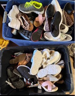 Three boxes full of shoes