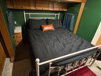Queen bed frame with bedding