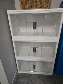 Storage bins with locking doors