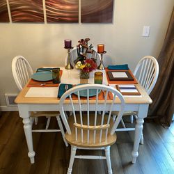 White tile kitchen table with 4 chairs