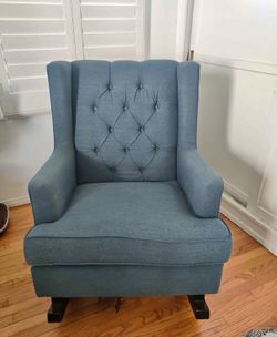 Blue upholstered glider rocker with foot stool glider