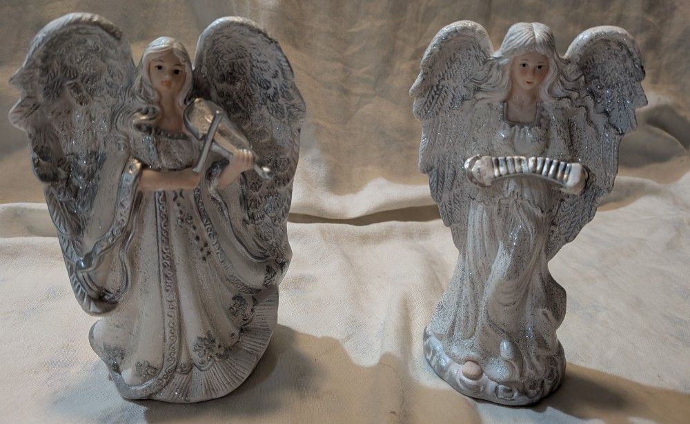 Two Decorative Angel Figurines Made Of Ceramic.