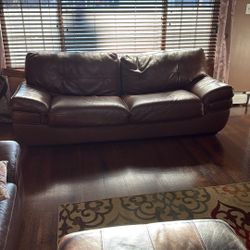 Two Sofas And An Ottoman 