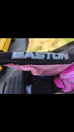 Pink glove girls red helmet and pink Wilson bag to carry it all