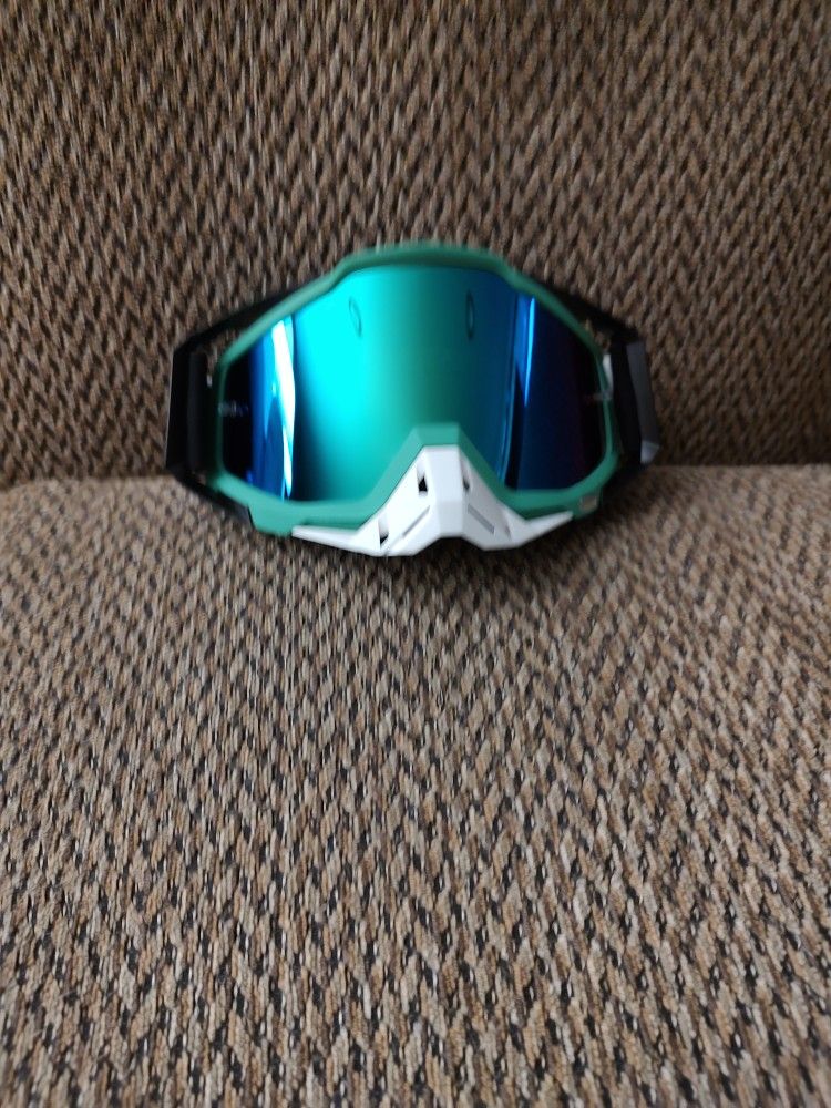 100%  MOTORCYCLE GOGGLES.  GREEN TINT.   ADJUSTABLE STRAP.  NEW.  PICKUP ONLY.