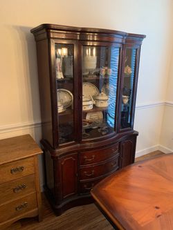 Vintage China cabinet has some bumps and bruises