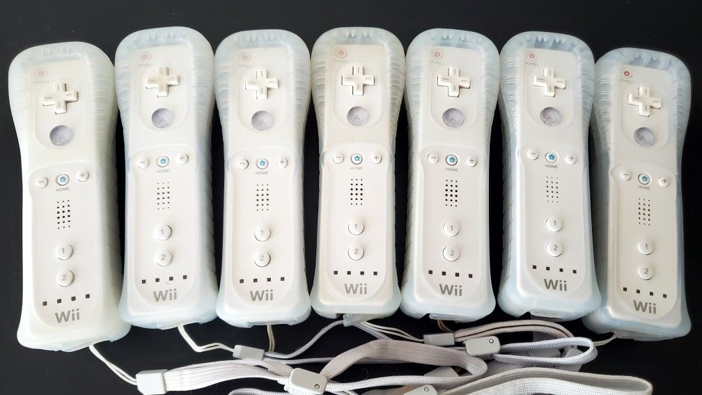 Nintendo wii Wiimotes controllers and rubber protector. Tested and working condition. All remotes are tested on wii sports and Mariokart.
 