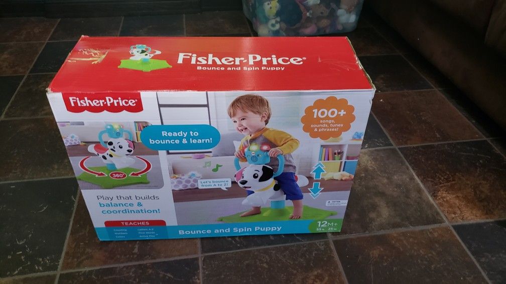 Fisher-Price Bounce and Spin Interactive Puppy with Lights & Sounds. boy