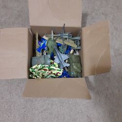 A Box Of Army Guys And Military Vehicles