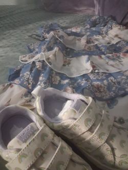 Baby girl clothes and pair of tom shoes