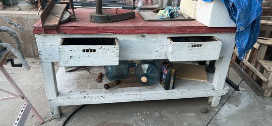 Wooden workbench with drawers and shelf