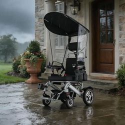 Medical Lightweight Foldable Electric Wheelchair with Sun Canopy, Suspension and Aluminum Frame in Black