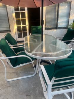 Glass table with 6 chairs