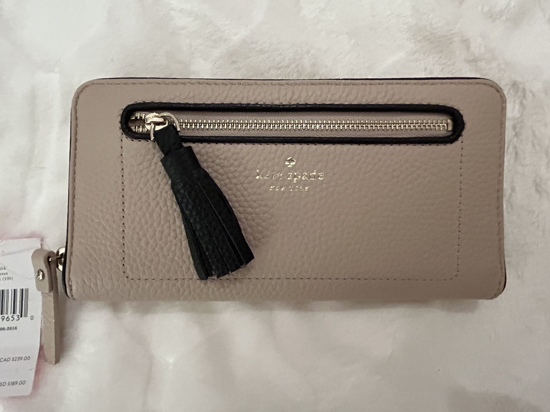 Kate Spade Wallet NWT retails for almost $200