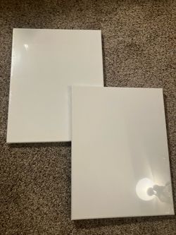 Two sealed white canvases