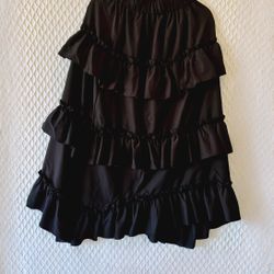 Mid-calf skirt, black, with fringe throughout. Size M. Cost: $15.