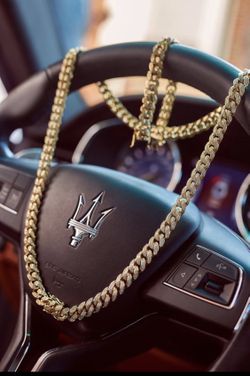 New 14 k yellow gold Cuban link chain and bracelet