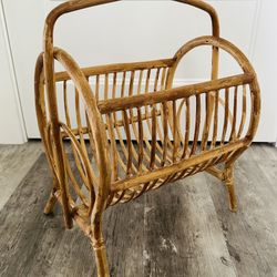 Large Vintage bamboo rattan boho magazine rack/ storage holder. 19 1/2” tall x  16” wide x 12” front to back . Nice curved design.