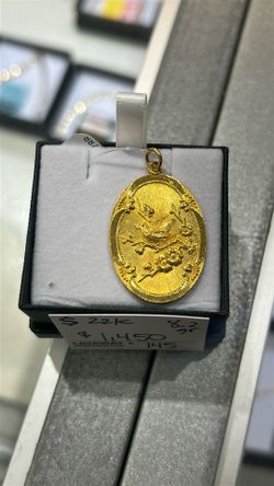 22k gold bird pendant