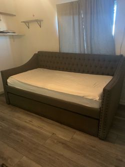 Twin bed with pullout mattress