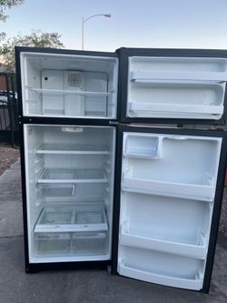 black General Electric  refrigerator / Nellis and Owens