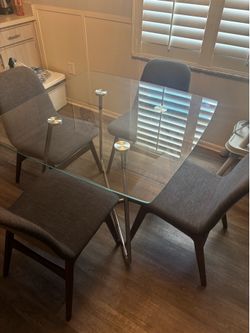 Small glass dining table with chairs