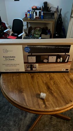 Expandable TV stand 31.5”W x 15.55” D x 14.59”H
