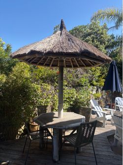 Bamboo table with thatch umbrella