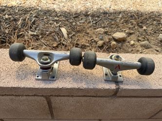 Set of venture trucks with wheels and extra set of baker red wheels