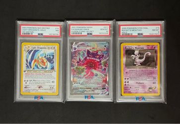 3 Pokemon PSA slabs