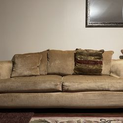 Copper-colored five-seater sofa with an ottoman 