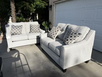Brand New. (Set of 2) Lane Love Seat Sofa’s. Tweed color with accent pillows.  $549