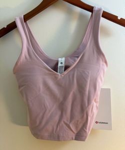 New with tags, pink Lulu Lemon top size 2