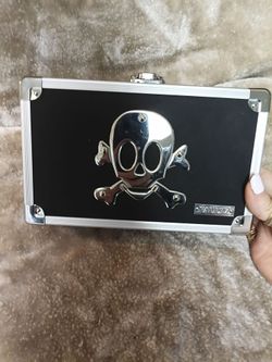 Vintage black and chrome "Skull" embossed VAULTZ small carrying case.