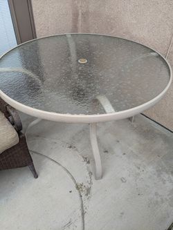 Metal outdoor table with umbrella hole