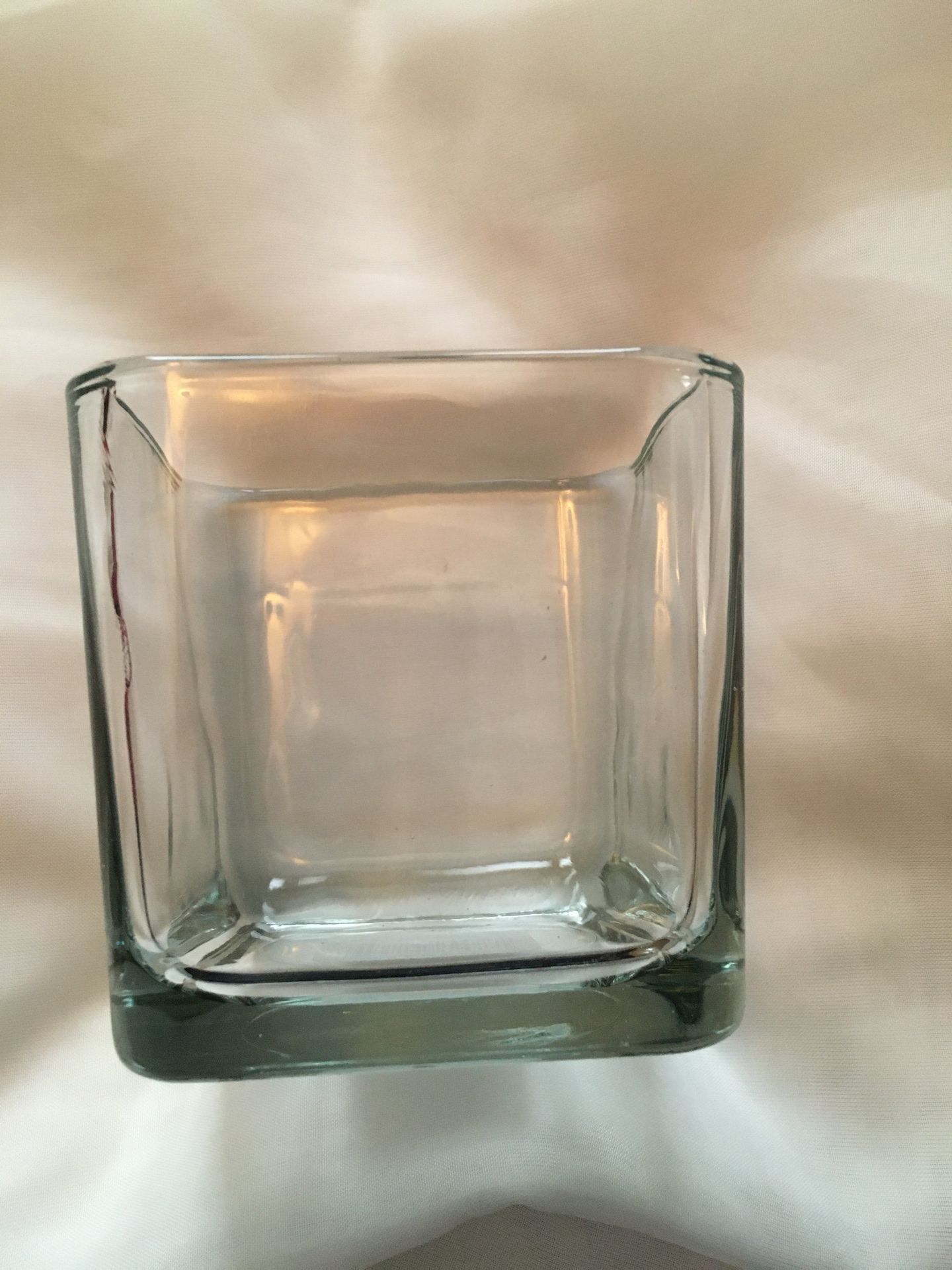 11 glass vases. 3.5 in. Tall x 3.5 in. Wide.