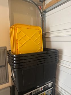6 black bins and 6 blue/ green bins