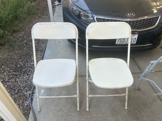 Pair of White Metal Folding Chairs – $10